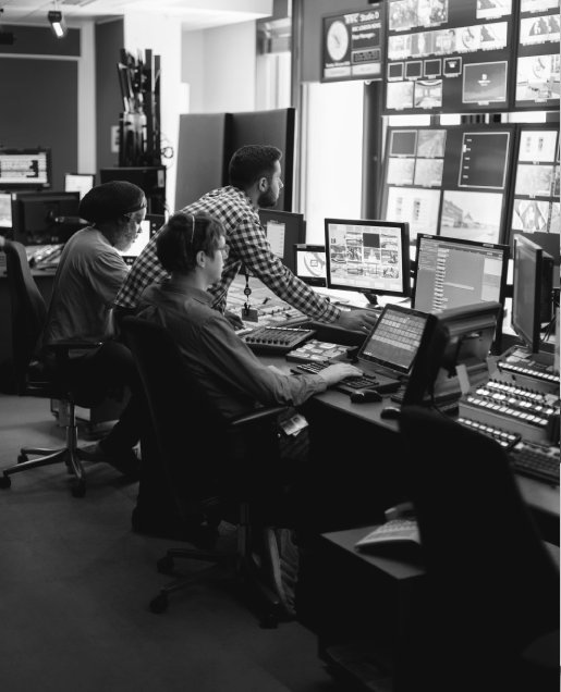 People collaborating at computer workstations