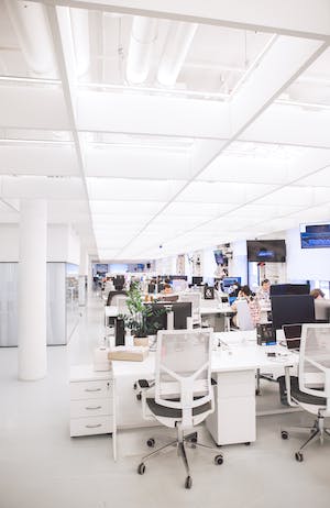 A bright open-plan workplace with desks and computers
